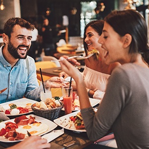 Group of friends eating a meal together