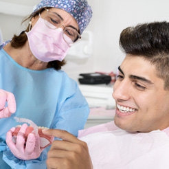 Patient in Barker Road Brookfield talking to dentist about Invisalign
