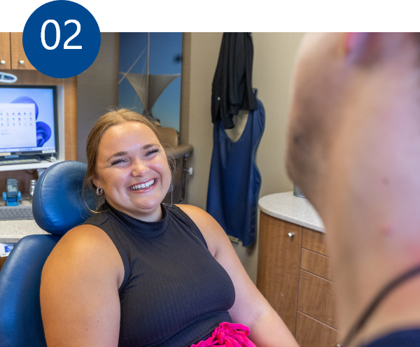 Dentist explaining a treatment to a patient